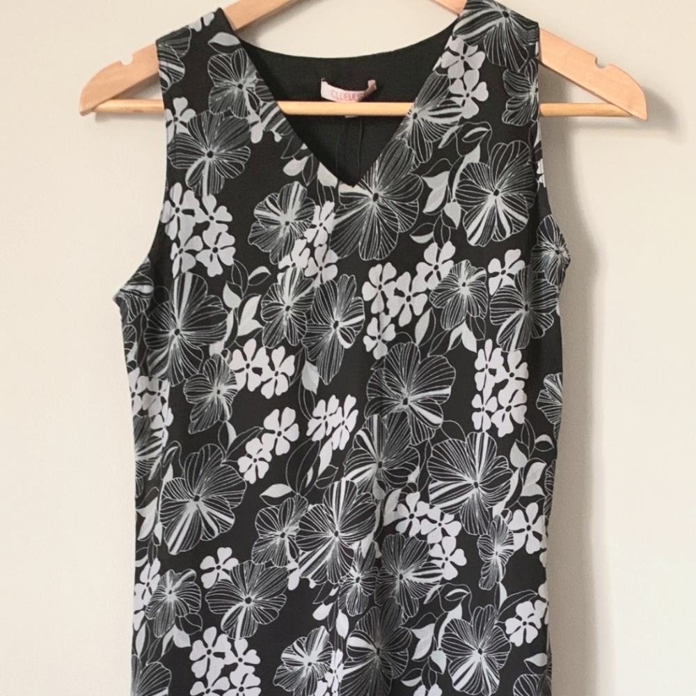 Brand new. Clueless. Size M. Black and White flowers. Zipper on the side. Medium